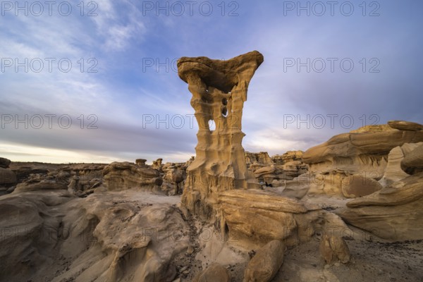 Captivating rock formations in Bisti De-Na-Zin Wilderness, New Mexico, USA Eroded sandstone creates unique shapes under a vast, colorful sky, showcasing nature's artistry