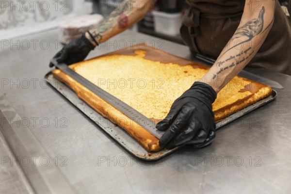 A baker skillfully measures pastry dough, showcasing precision in preparation The scene captures the essence of an Italian bakery, highlighting craftsmanship and tradition
