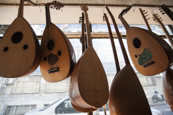 Handmade Oud hanging inside the window display of Veysel Muzik Evi, Istanbul. Produced by Cengiz Sarikus Baglama and Oud hanging inside the window display of Veysel Muzik Evi, Istanbul. Produced by Cengiz Sarikus