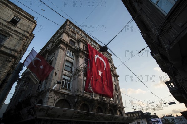Istanbul, Turkey. July 2rd 2016 Turkish flag hanging from a European style building in the Beyoglu neighborhood of Istanbul, Turkey