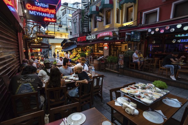 Istanbul, Turkey. July 17th 2023 Nightlife with bars and diners eating at restaurants in Balik Pasaji on Istiklal Street, Taksim, Istanbul, Turkey