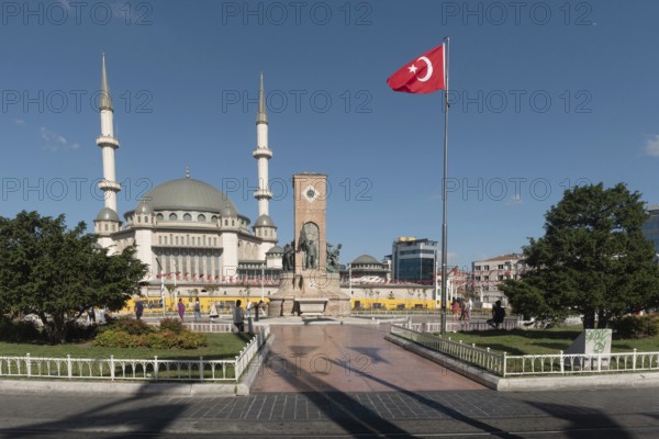 Istanbul, Turkey. July 18th 2023 Turkish Republic Monument or Ataturk Statue and the recently built Taksim Mosque opposite Gezi Park close to Istiklal Street in Istanbul, Turkey