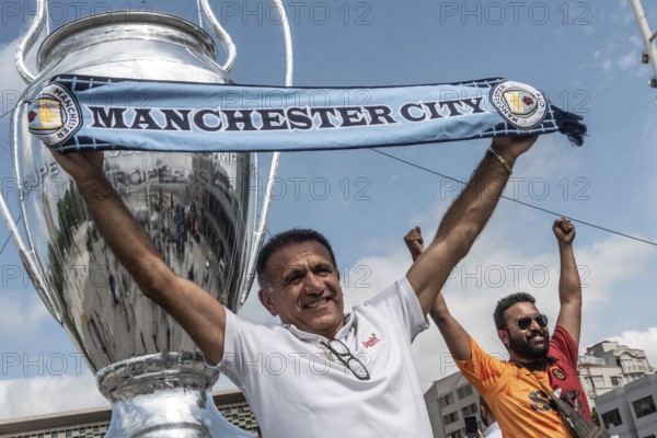 Istanbul, Turkey. June 9th 2023 A Manchester City football fan poses with a scarf in Taksim Square before the UEFA Champions League Final, Istanbul, Turkey