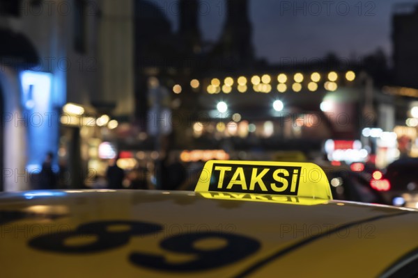Istanbul Turkey. October 23rd 2021 Yellow Turkish Taxi Sign at night in Taksim Square Istanbul, the second largest city in Turkey