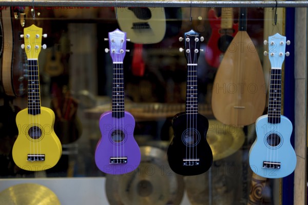 Istanbul, Turkey. October 3rd 2021 Colorful toy guitars for sale outside a musical instrument shop on Galip Dede Street, Istanbul, Turkey