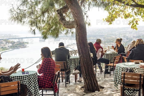 Istanbul, Turkey. October 12th 2021 People enjoy Turkish tea and coffee and a view of the Golden Horn from the famous Pierre Lotti Cafe in the Eyup District of Istanbul, Turkey