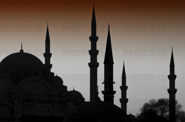 Turkish Istanbul Islamic architecture of domes and minarets silhouetted at night, an iconic cityscape skyline of the ancient ottoman capital and second city of Turkey