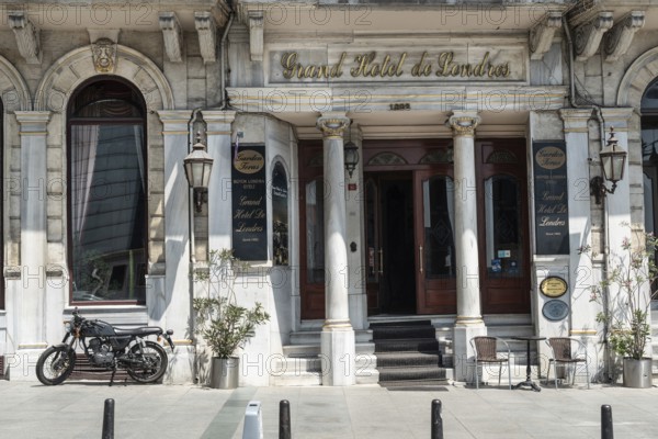 August 2nd 2021 Istanbul, Turkey An Antique motorbike parked outside The Grand Hotel de Londres in the trendy Pera district near Taksim on the European side of Istanbul, Turkey