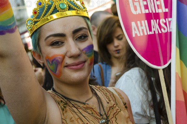Istanbul, Turkey. 28th June, 2015 A young Turkish woman with rainbow face paint celebrates Gay Pride in Istanbul, Turkey