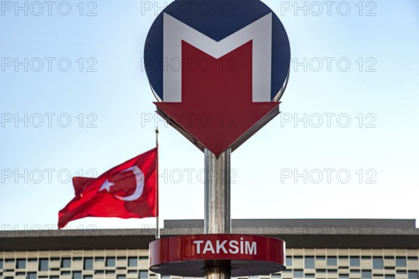 Istanbul, Turkey. November 22nd 2023 Red, White and Blue Sign for Taksim Metro with the Turkish flag in the background