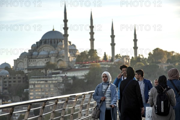 Istanbul, Turkey. November 14th 2023 Commuters leave Halic Metro station with the minarets of Suleymaniye Mosque in the background, Karikoy, Istanbul, Turkey