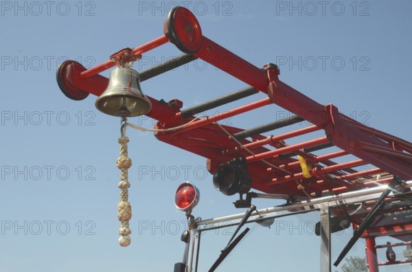Bell on ladder on veteran fire truck in Ystad, Skåne County, Sweden, Scandinavia