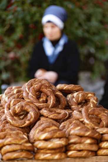 Freshly baked Turkish Simit, a sesame seed bagel type bread roll sold from street carts, a traditional staple cuisine usually eaten for breakfast with tea in Turkey