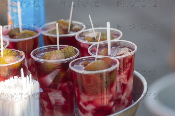 Glasses of fermented pickle juice for sale beside fish restaurants in Istanbul, the popular traditional Turkish drink is said to cure hangovers, Turkey