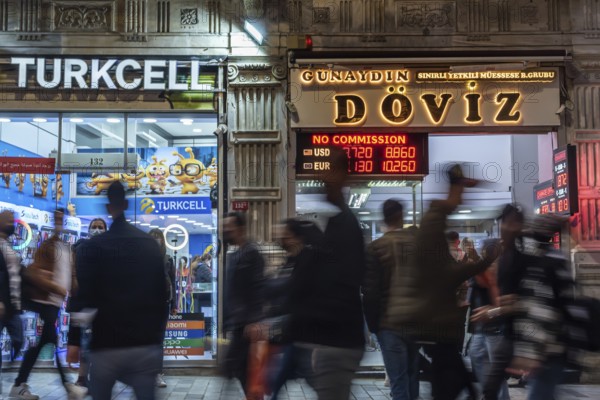Istanbul, Turkey. October 5th 2021 Blurred people moving in front of a currency exchange office on a busy Istiklal Street, Taksim, Istanbul, Turkey