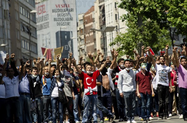 Istanbul, Turkey. June 1st 2013 Turkish protestors confront police with hand gestures during the Gezi Park demonstrations, Istanbul, Turkey