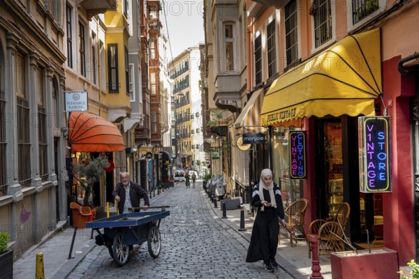 Istanbul, Turkey. May 17th 2022 Daily life in fashionable Serdar i Ekrem Caddesi, a popular street near the Galata Tower with cafes and boutique shops, Pera district, Beyoglu, Istanbul, Turkey