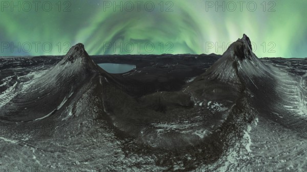 A breathtaking panorama of the Northern Lights dancing over two snow-dusted peaks in the Icelandic wilderness under a starlit sky