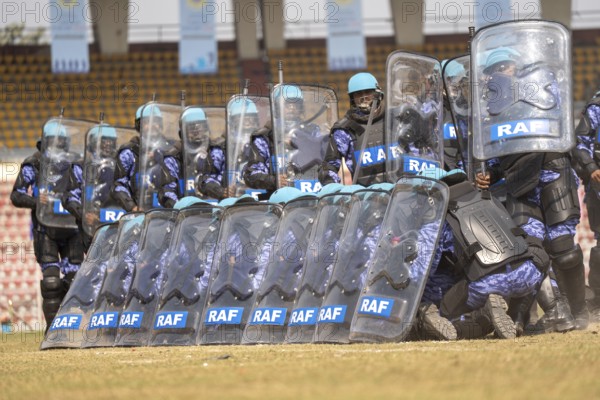 Personnel of the Rapid Action Force (RAF), a specialised unit of the Central Reserve Police Force, conduct an anti-riot drill with protective shields during the 87th Raising Day celebrations, on February 19, 2026 in Guwahati, India