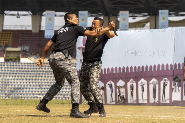 Personnel of the Central Reserve Police Force demonstrate close-combat training techniques during a drill at the 87th Raising Day celebrations, on February 19, 2026 in Guwahati, India