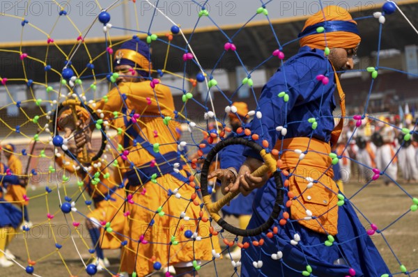 Performers in traditional attire presents a Gatka martial arts display during the 87th Raising Day celebrations, on February 19, 2026 in Guwahati, India