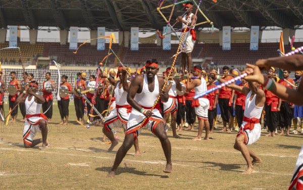 Performers stage a traditional martial arts display with swords and synchronised movements during the 87th Raising Day celebrations, on February 19, 2026 in Guwahati, India