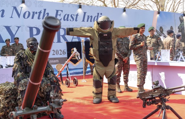 CRPF personnel display a bomb disposal suit and various weapons during a public exhibition at the 87th Raising Day celebrations of the Central Reserve Police Force, on February 19, 2026 in Guwahati, India