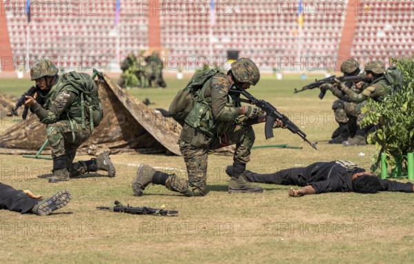 Personnel of the Central Reserve Police Force simulate a counter-terror operation, as they neutralising mock militants during a tactical drill at the 87th Raising Day celebrations, on February 19, 2026 in Guwahati, India