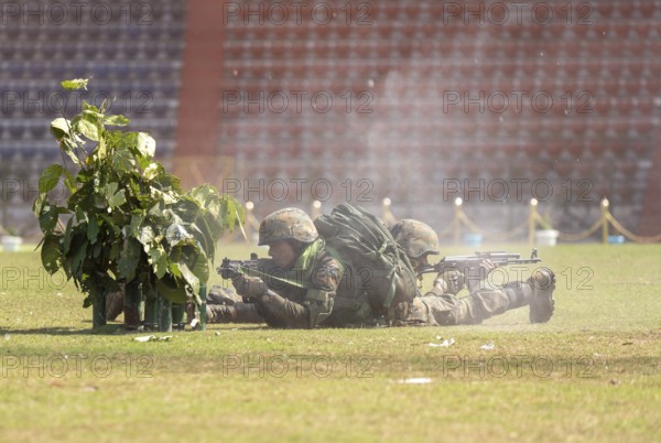 Personnel of the Central Reserve Police Force simulate a tactical operation as he taking position during a combat drill at the 87th Raising Day celebrations, on February 19, 2026 in Guwahati, India