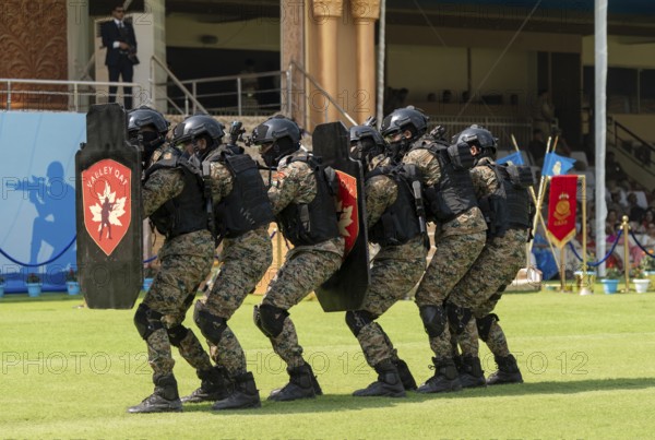 Personnel of the Valley QAT unit of the Central Reserve Police Force advance in shield formation during a simulated counter-terror drill at the 87th Raising Day celebrations, on February 19, 2026 in Guwahati, India