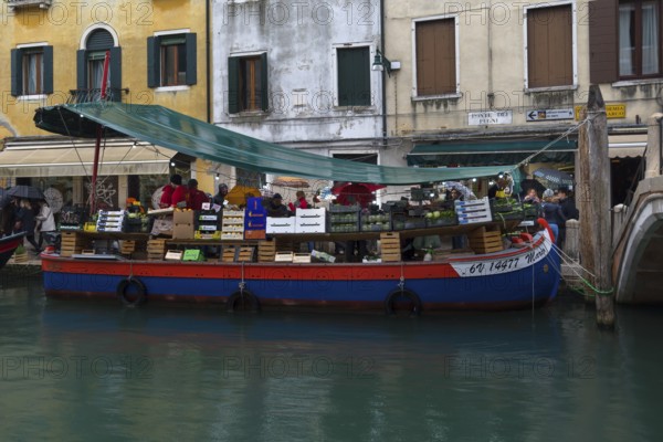 Selling fruit and vegetables on a boat, Venice, Veneto, Italy