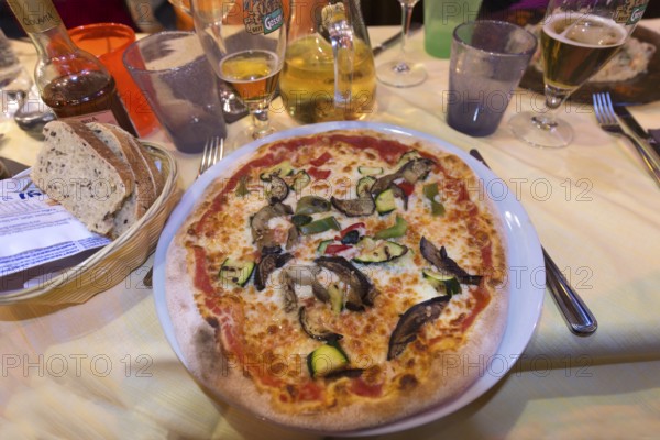 Vegetarian pizza in a restaurant, Italy