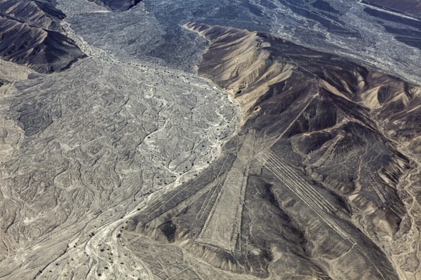 Wide mountain and desert area with recognizable Nazca lines in Peru, the geoglyphs and images in the desert near Nasca and Palpa in Peru