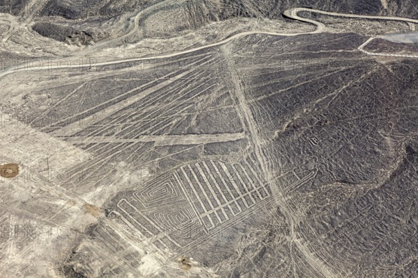 Aerial view of a desert region with numerous Nazca line patterns in Peru, the geoglyphs and images in the desert near Nasca and Palpa in Peru