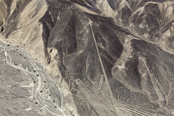 Desert hills with clearly recognizable line patterns and drawn shapes, the geoglyphs and drawings in the desert near Nasca and Palpa in Peru