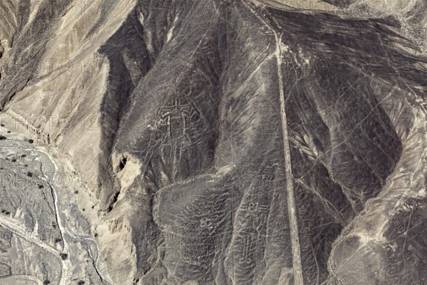 Image of the Nazca Lines showing historic geoglyphs on sandy hills, The geoglyphs and drawings in the desert near Nasca and Palpa in Peru