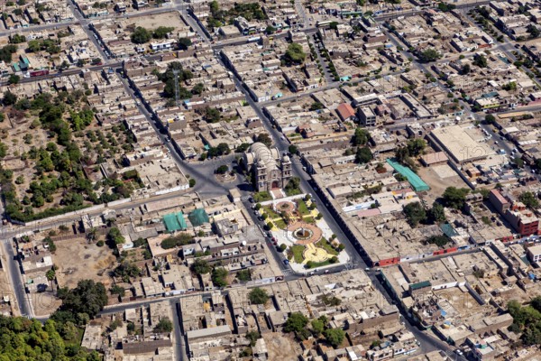 Aerial view of a city with clearly visible roads and buildings, details of urban planning visible, The city of Nasca in Peru