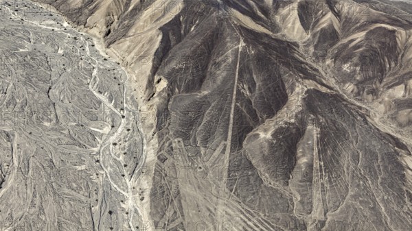 Desert landscape with visible line formations and elevations, the geoglyphs and images in the desert near Nasca and Palpa in Peru