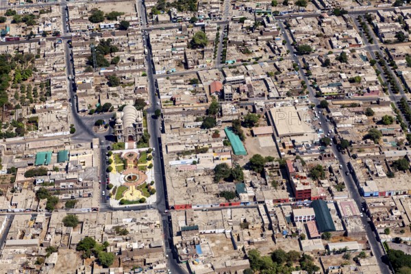 Aerial view of a city with a clear view of buildings and geometric road network structure, The city of Nasca in Peru