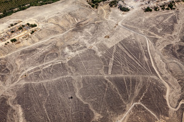 Aerial view of Nazca lines in the desert with clearly visible geoglyphs, the geoglyphs and images in the desert near Nasca and Palpa in Peru