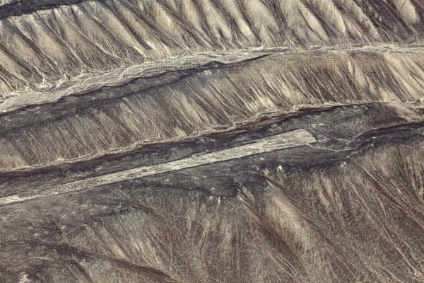 Geoglyphs of the Nazca on the sandy hills of Peru, seen from the air, The geoglyphs and paintings in the desert near Nasca and Palpa in Peru