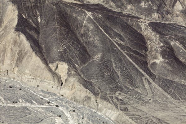 Mystery of the Nazca Lines on dry hills, observed from the air, The geoglyphs and images in the desert near Nasca and Palpa in Peru