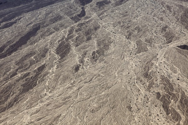 Detailed illustration of a dry riverbed with complex earth formations and exemplary textures in a desert landscape, The desert landscape near Nasca in Peru