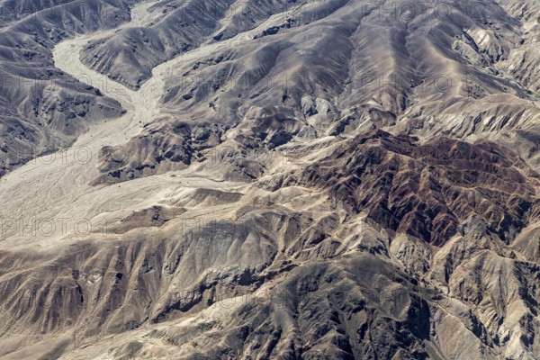Detailed rock and mountain formations in a barren desert landscape, the desert landscape near Nasca in Peru