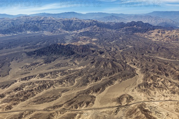 Barren mountainous desert area with characteristic hills, taken from above, The desert landscape near Nasca in Peru