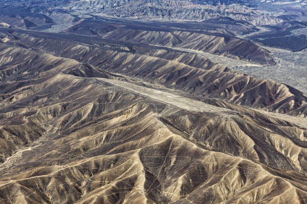 Hilly desert landscape with deep gorges and rock formations, The desert landscape near Nasca in Peru