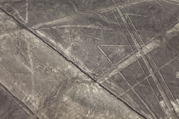 Brown exotic landscape with ancient lines and patterns, the geoglyphs and paintings in the desert near Nasca and Palpa in Peru