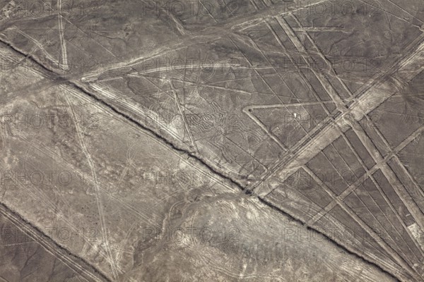 Lines and patterns form on a dry desert surface, the geoglyphs and drawings in the desert near Nasca and Palpa in Peru