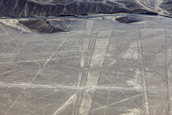 View of lines and patterns on a sandy, dry surface, the geoglyphs and drawings in the desert near Nasca and Palpa in Peru