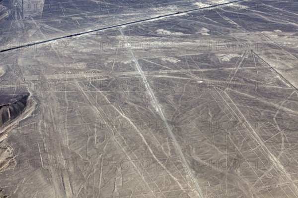 Ancient Nazca lines and patterns on the surface of an extensive desert landscape, the geoglyphs and drawings in the desert near Nasca and Palpa in Peru